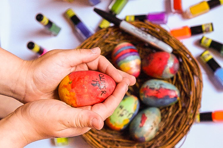 hand with Keepsake DIY Easter Eggs