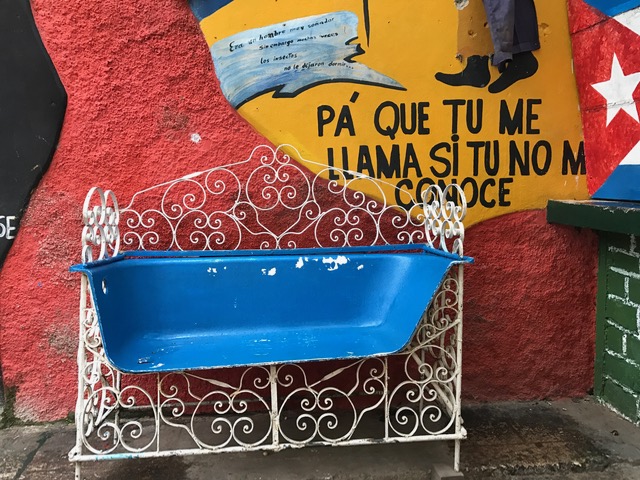 Decorated bathtub cut in half in Cuban street. 