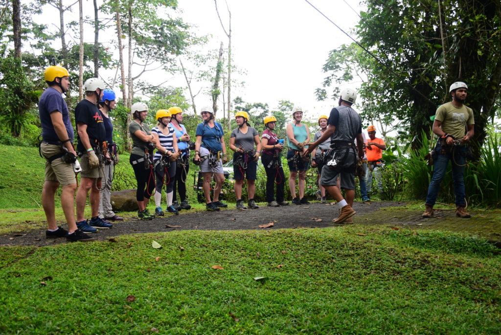 a group of people ready for ziplining