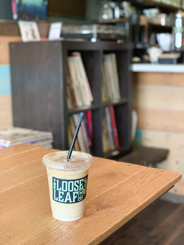 a cup of coffee in the table inside the Loose Leaf Coffee Shop