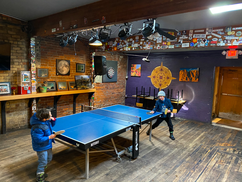 two boys playing table tennis