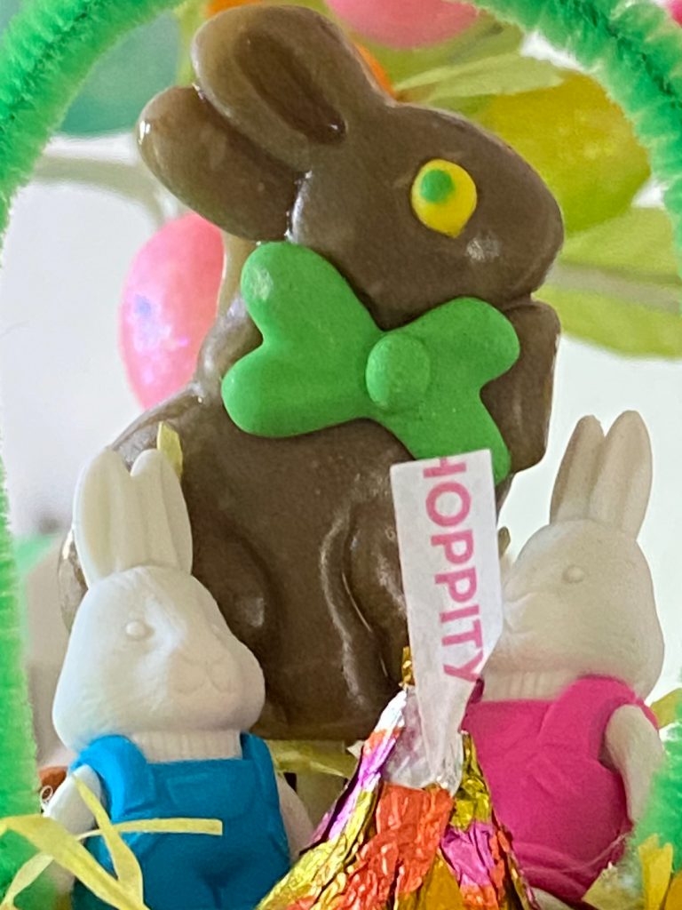 chocolate bunny with bunny erasers and a Hershey's kiss