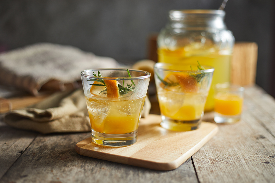 two glasses of orange juice with rosemary for Foods that Last A Long Time