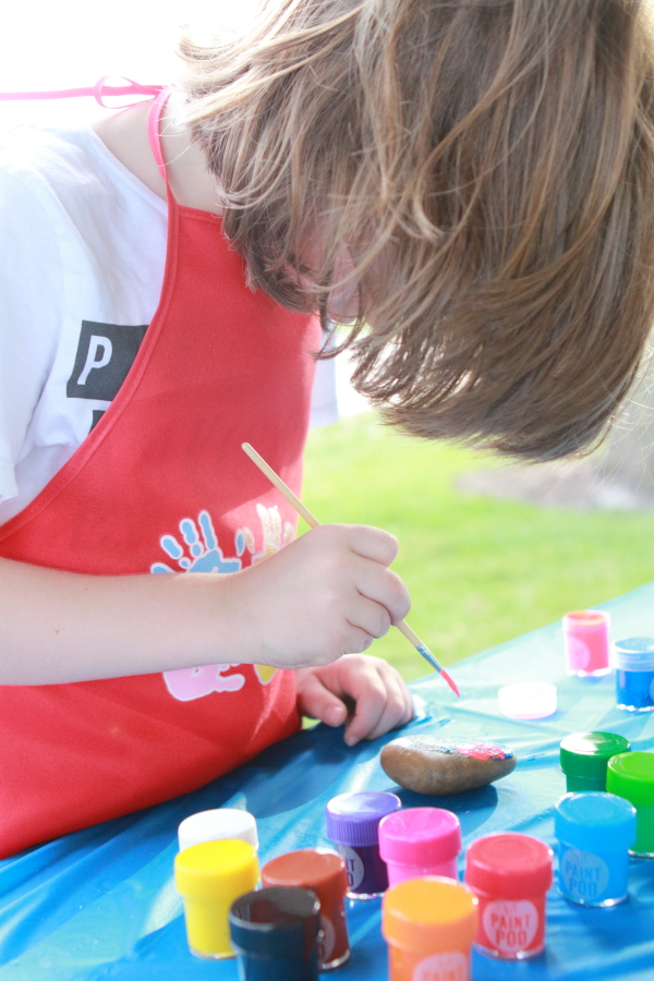 Boy painting a rock for DIY Rock Painting Idea for Kids