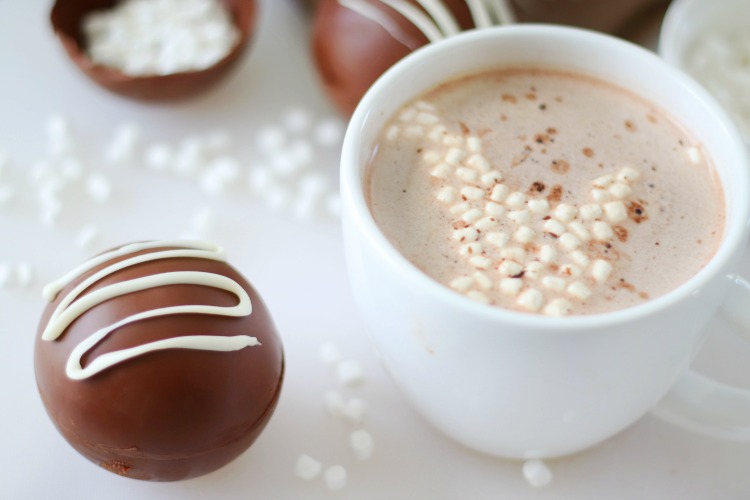 Hot chocolate in a white mug with DIY hot cocoa bombs
