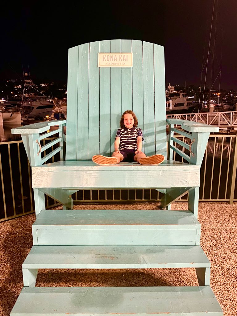 blue beach chair with boy